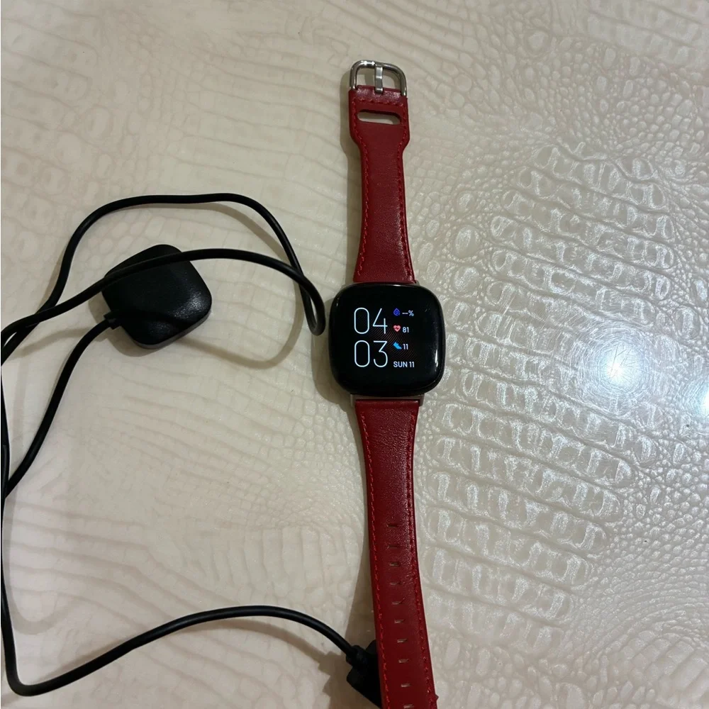 Fitbit Smartwatch with Red Strap